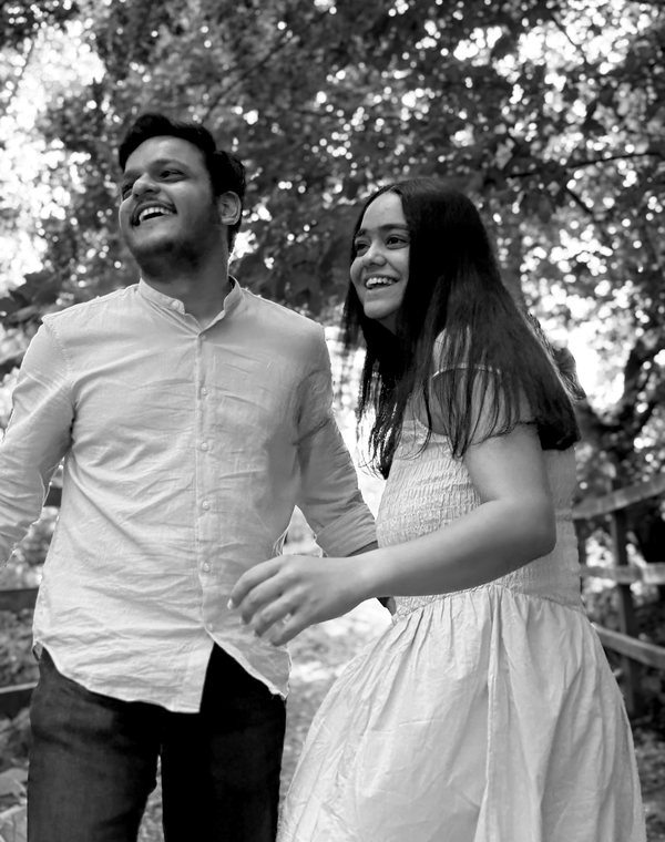 Raj and Lavina laughing on a woodland walk